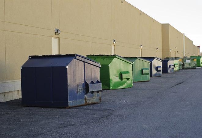 metal waste containers sit at a busy construction site in Bristolville